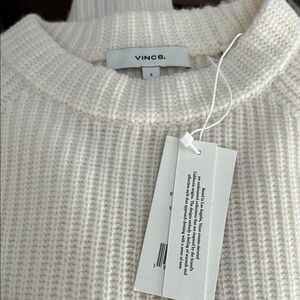 New with tags, women’s Vince cream fisherman cashmere sweater, size small.
